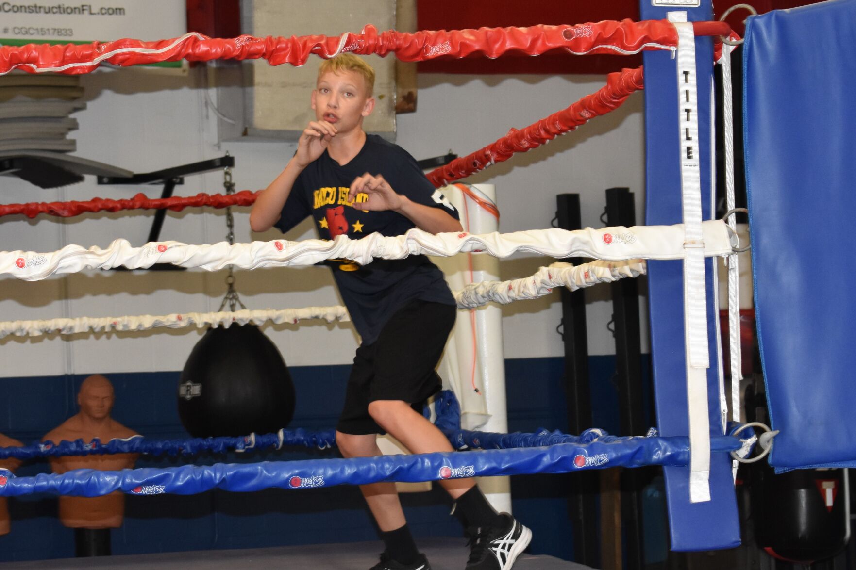 Kids Living Their Best 2. Asher Graham practices in the ring..jpg